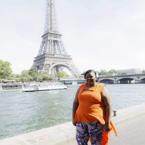 orange peplum top with long back tail